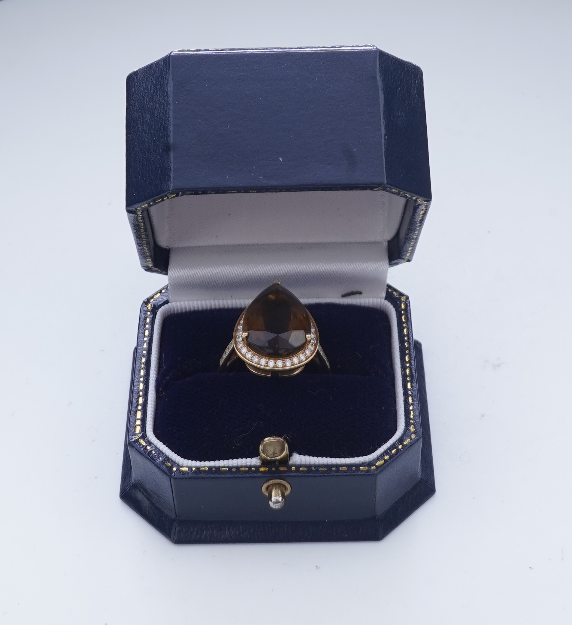 A smoky quartz and diamond ring